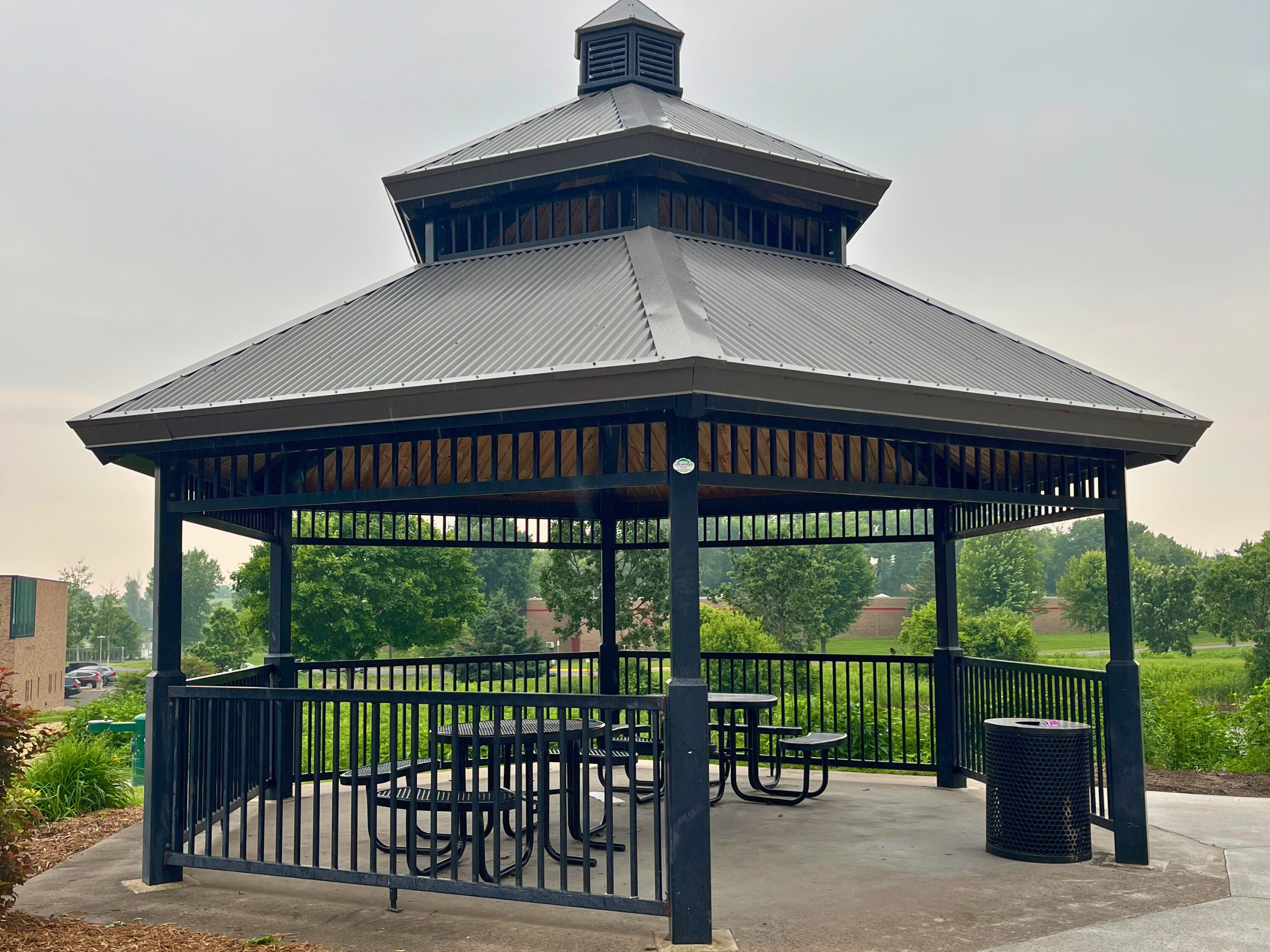Park shelter with picnic tables at the VMCC playground