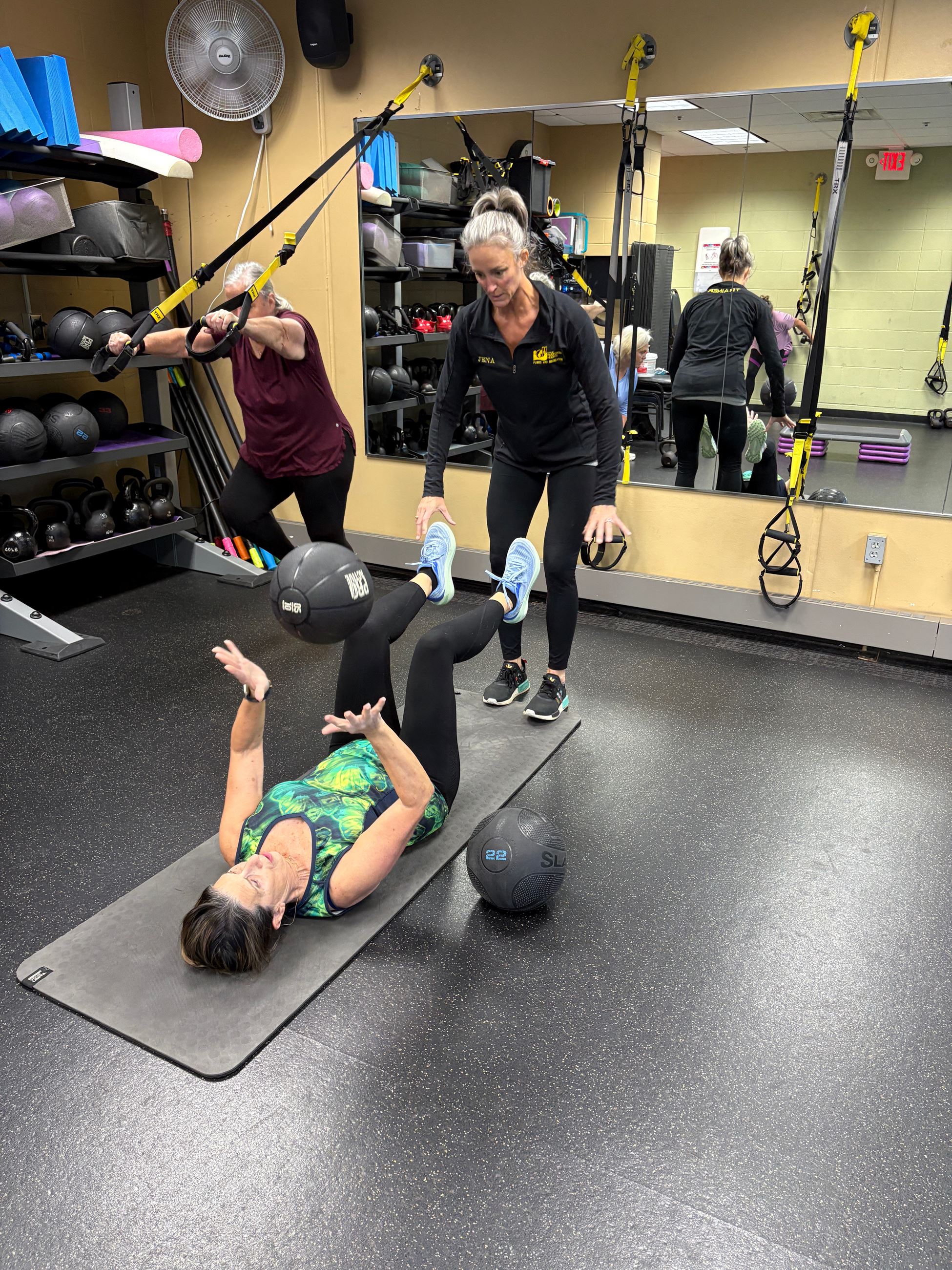 Personal trainer working with a client